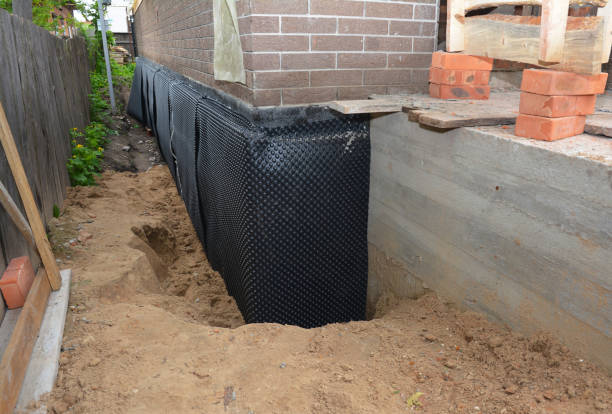 Happy homeowners after waterproofing job in Mount Summit